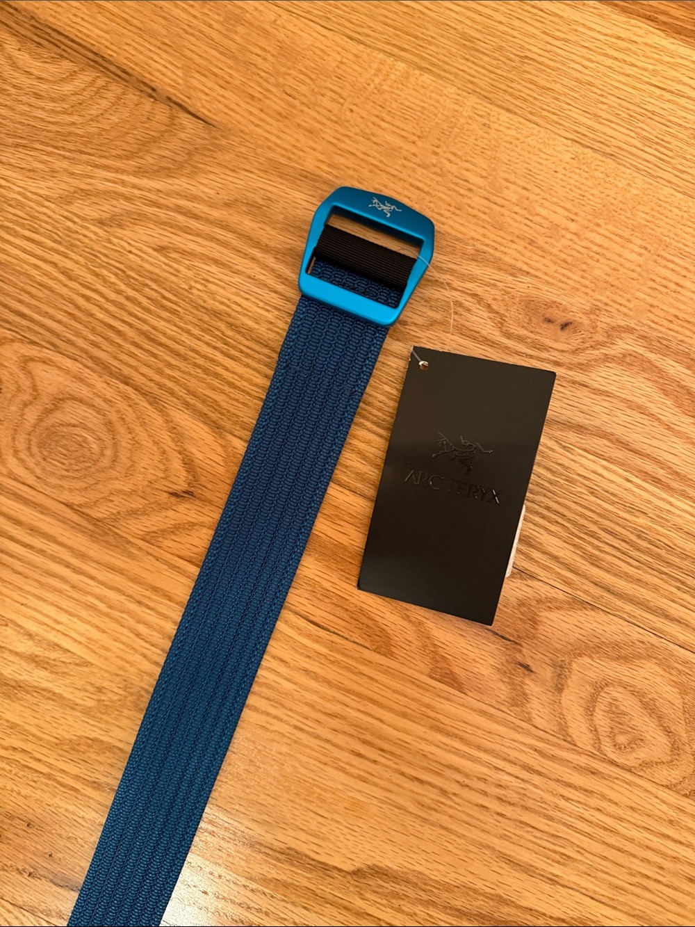 Arc'teryx Blue Webbing Belt with a bright Buckle
